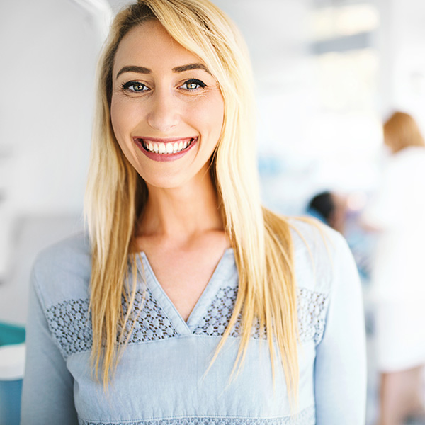 Woman smiling showing her white teeth