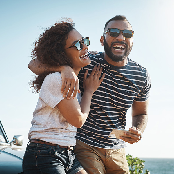Couple smiling showing their white teeth