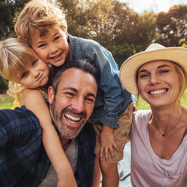 Happy family smiling having a good time outdoors