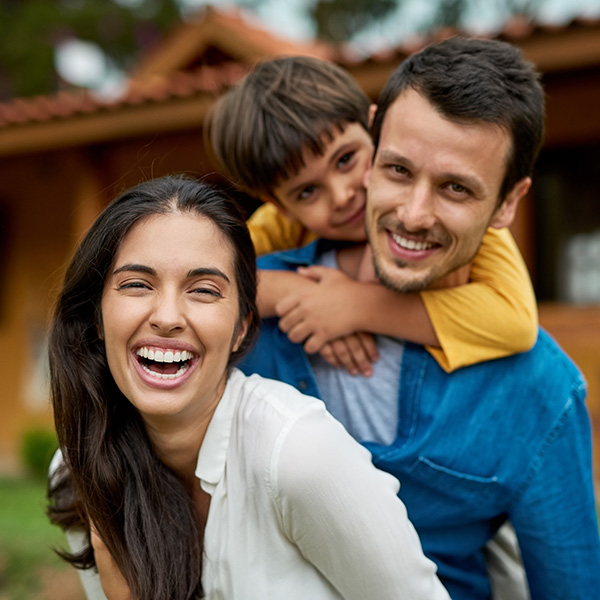 Happy family smiling having a good time outdoors