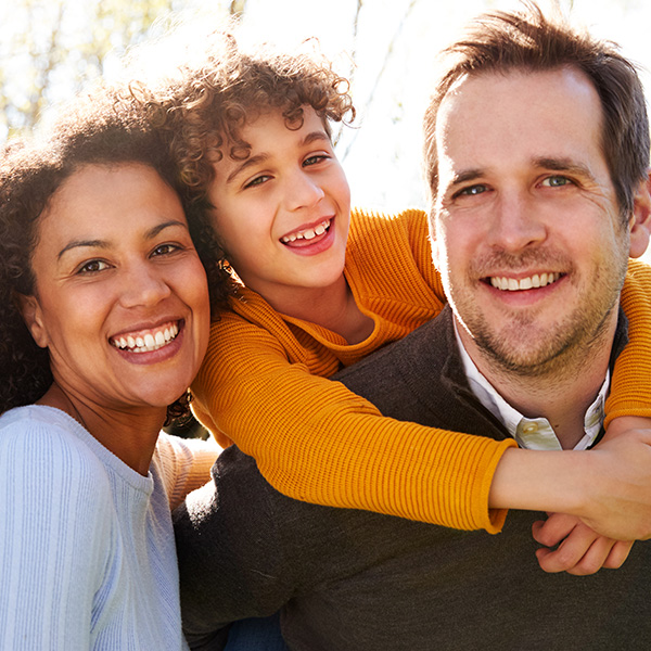 Happy family smiling having a good time outdoors