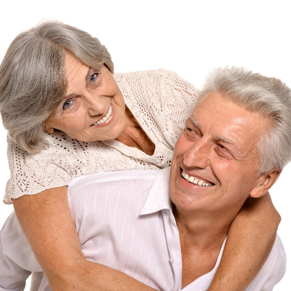 Happy couple smiling showing their white teeth