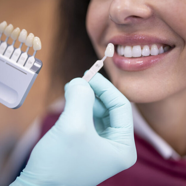 Woman smiling looking at dental crowns