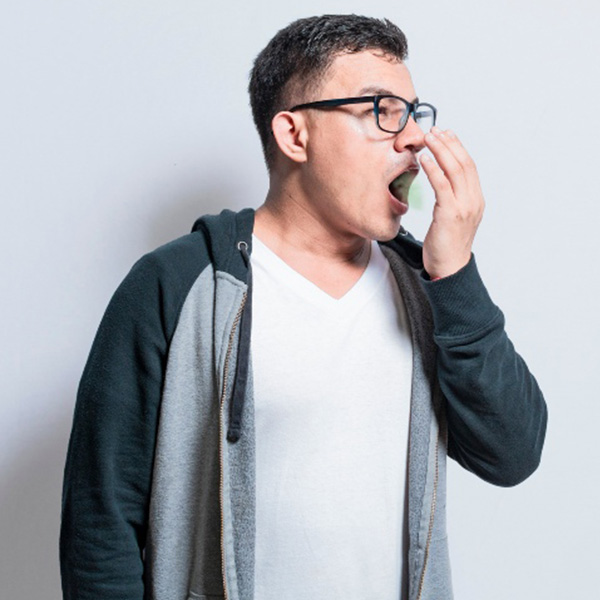 Man suffering from bad breath condition
