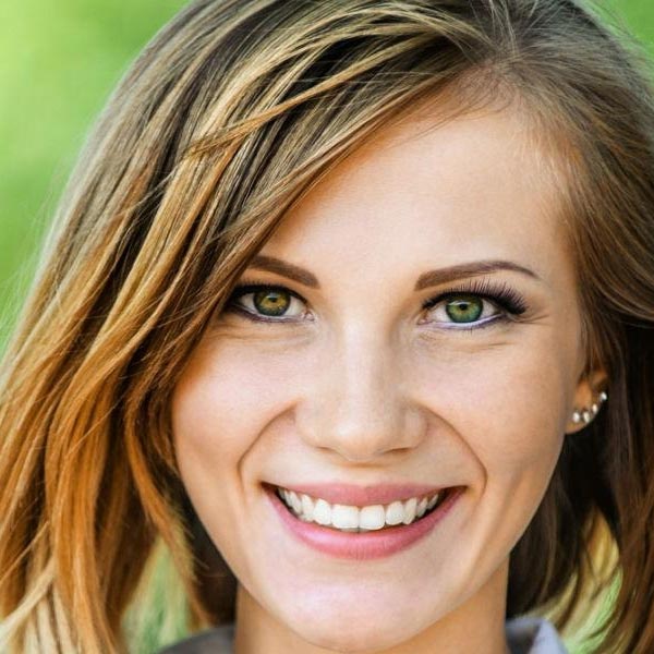 Happy woman smiling showing her white teeth