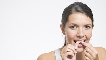 Woman checking her teeth
