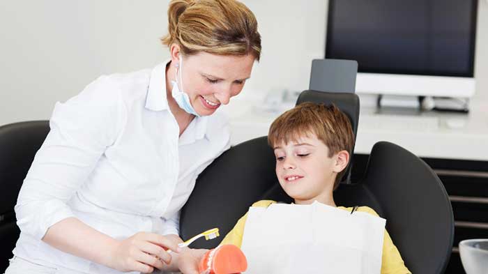 Dentist treating her patient