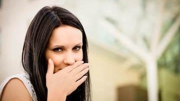 Woman not wanting to show her teeth