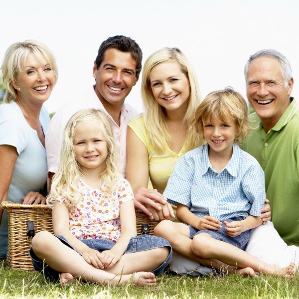Happy family having a picnic smiling
