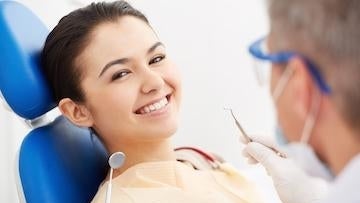 Woman getting treating by a dentist