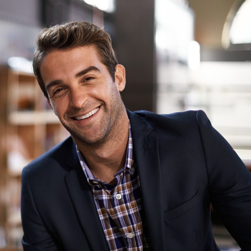Happy man smiling showing his white teeth