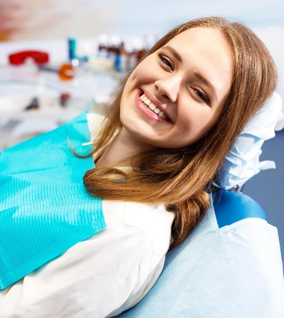 girl smiling in dentist chair
