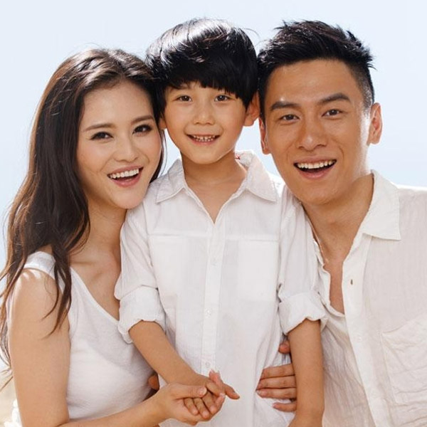 family of three smiling together