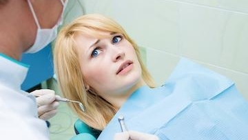 Girl worried at the dentist