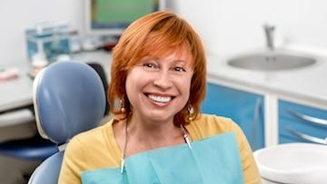 Patient sitting on dental chair