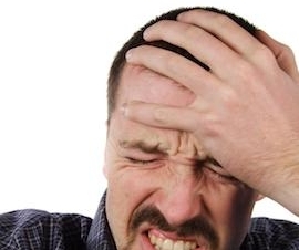 Man holding his head because of headache