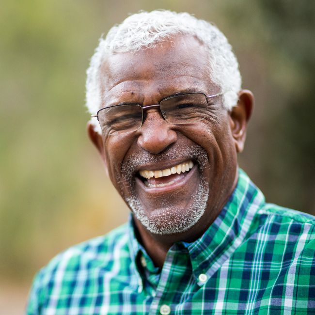 A man very happy with the results of the full-mouth restoration procedure in North Phoenix, AZ