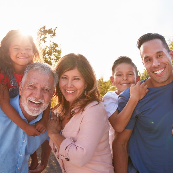 large three generations family smiling in vineyard