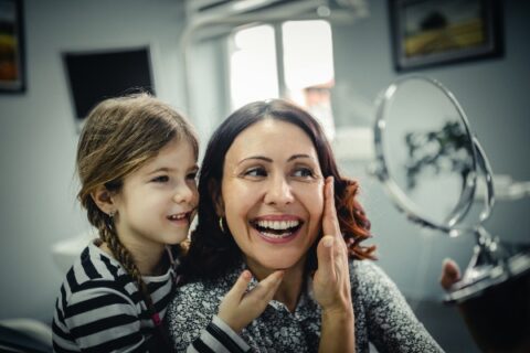 Child and mother visiting Matthew J. Cavendish DDS dental office for family dental care