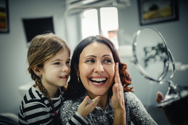 Child and mother visiting Matthew J. Cavendish DDS dental office for family dental care