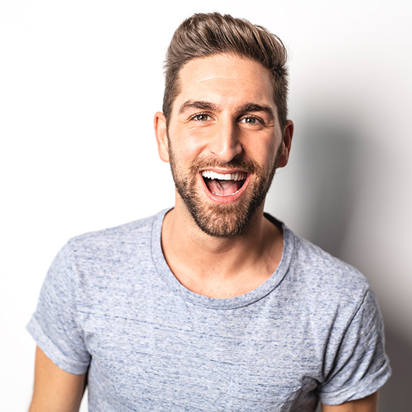 Man smiling showing his white teeth