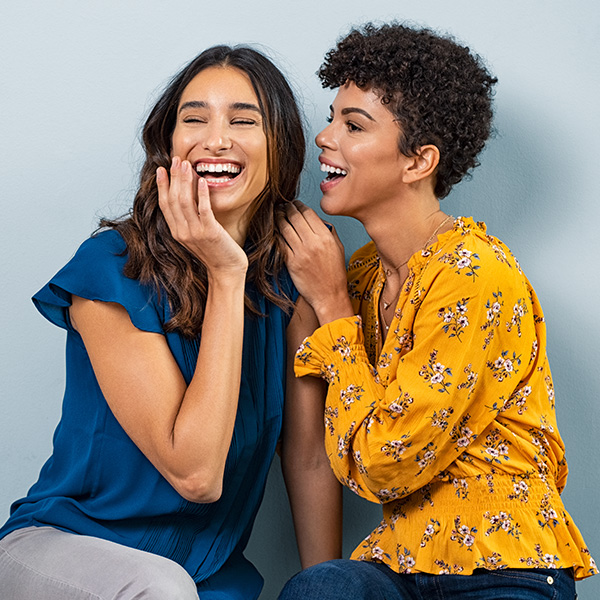 Women smiling showing their white teeth