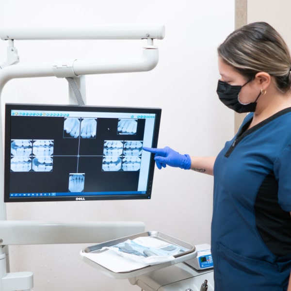 Dentist looking at x-ray results